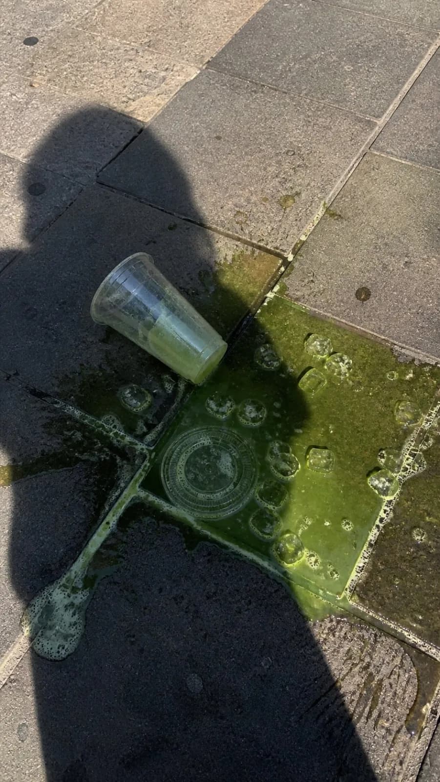 Spilled Green Iced Drink on Outdoor Pavement AI photo prompt example on PhotoReady
